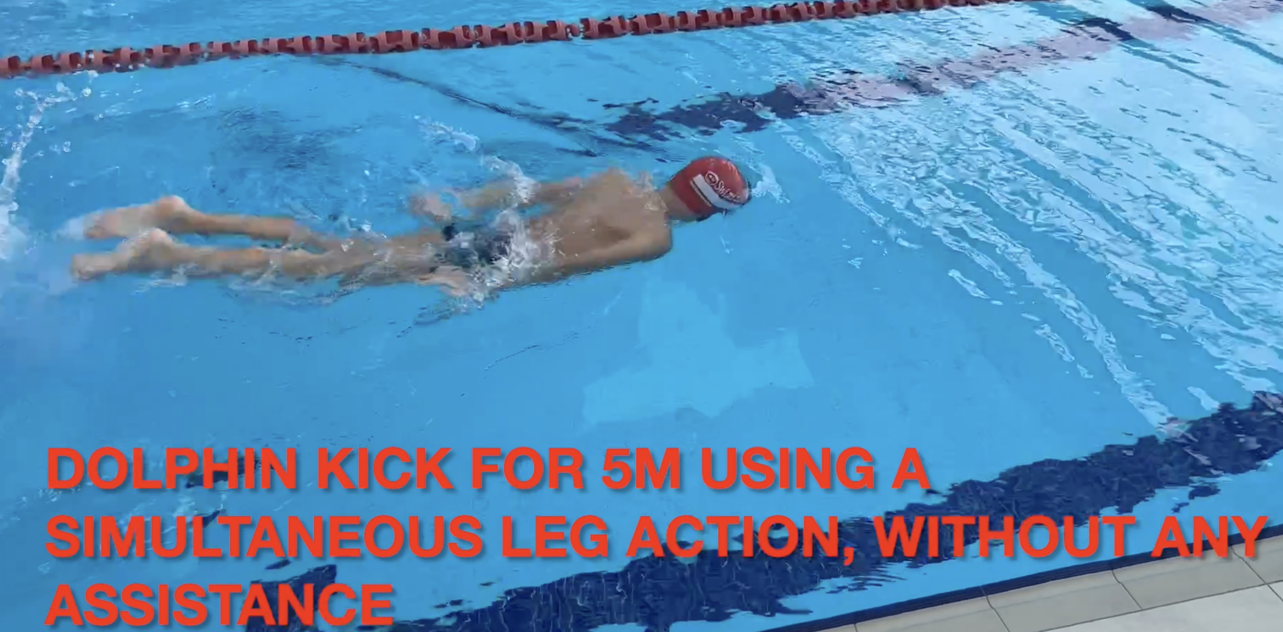 Young swimmer practicing dolphin kick and butterfly basics the SwimEasy Way