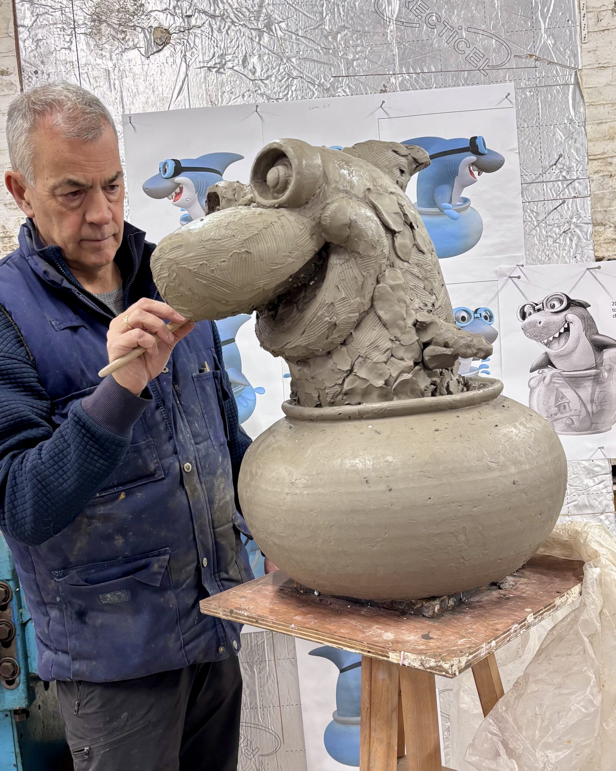 Brian Caster at Powderhall Bronze hand-sculpting Snapper the Shark for the SwimEasy bespoke swimming curriculum